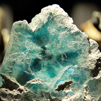 "Brucite mineral specimen on display"





