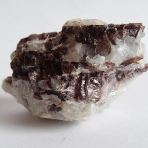 "Axinite gemstone: grounding and healing energy."