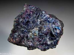 "Covellite: Rare indigo-blue mineral with iridescence."





