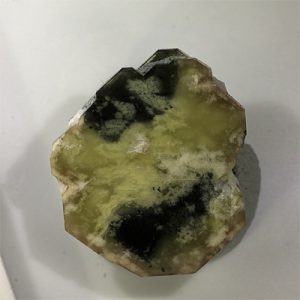 Rare black gemstone with intricate crystal structure.