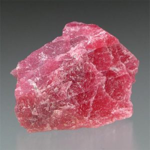 Pinkish-brown pyroxmangite mineral sample