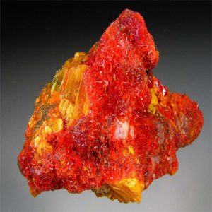 Realgar: Vibrant red mineral, toxic, used historically in medicine, art, and pyrotechnics.