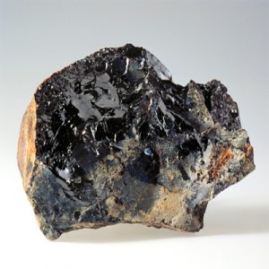 Samarskite: Rare earth mineral with diverse industrial uses.