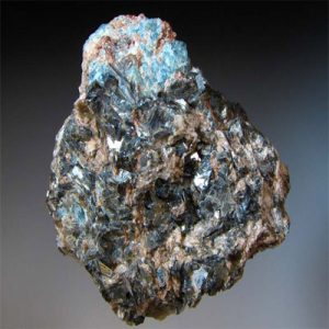 Blue sapphirine mineral specimen on display.