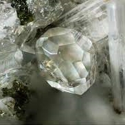 Sarcolite gemstone: a rare, translucent mineral with green hues, prized for its unique beauty 