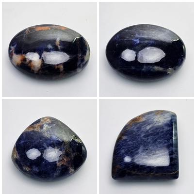 Sodalite: Blue gemstone with white veins.