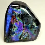 Spectrolite gemstone showcasing vibrant iridescence, believed to offer protection and healing properties.