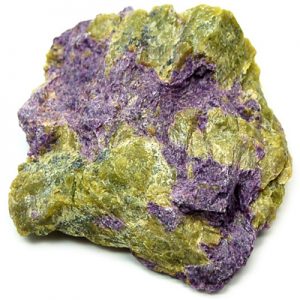 Vivid purple Stichtite mineral sample against dark background.