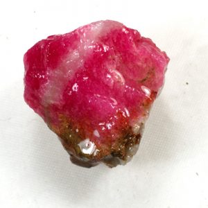 Vibrant pink tugtupite gemstone.